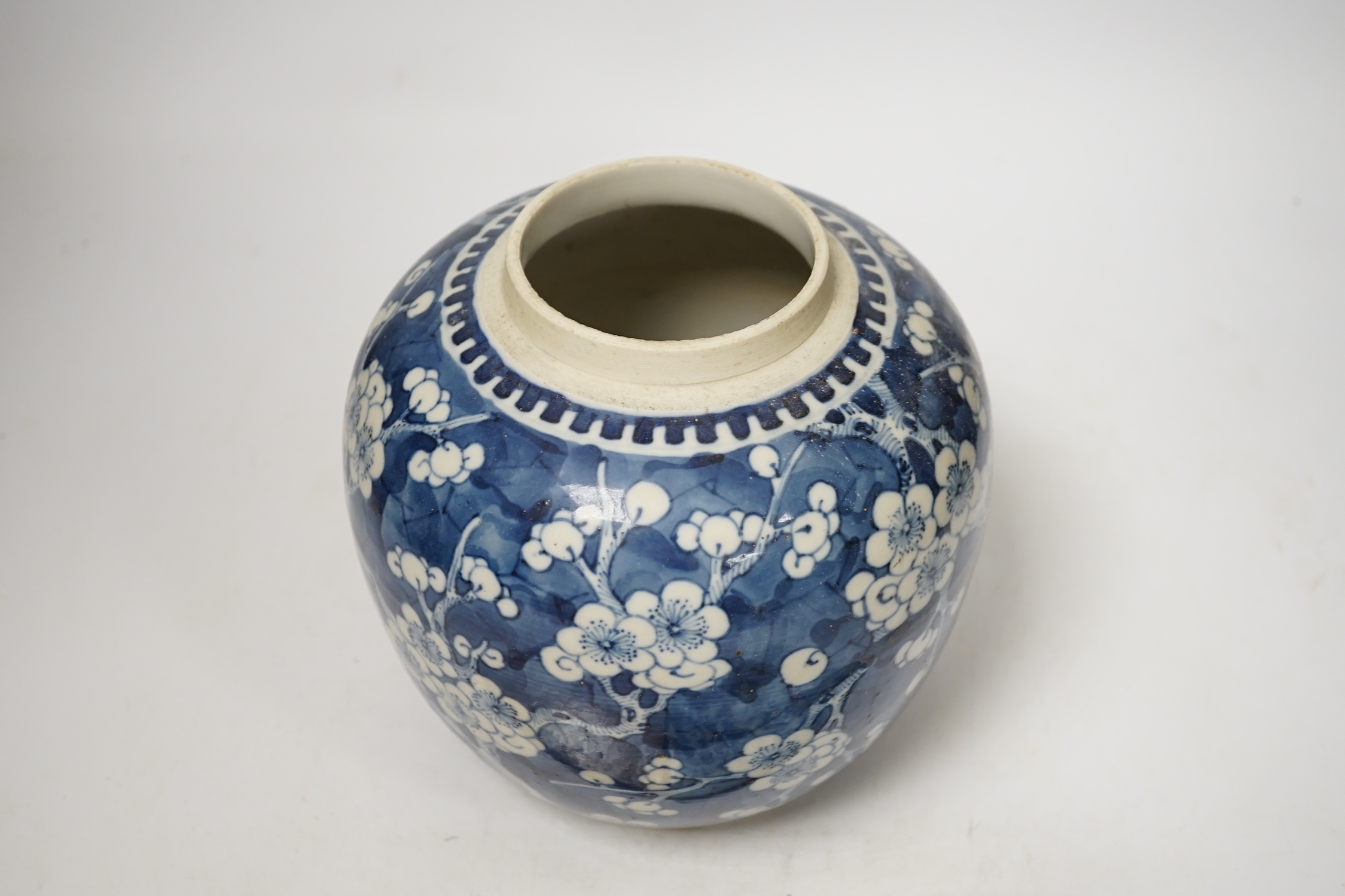 A 19th century Chinese blue and white prunus jar and cover, together with two similar tiles, jar 21cm